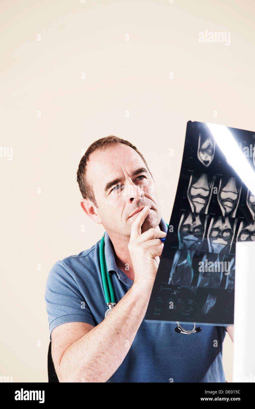 Doctor looking at an X-ray Stock Photo