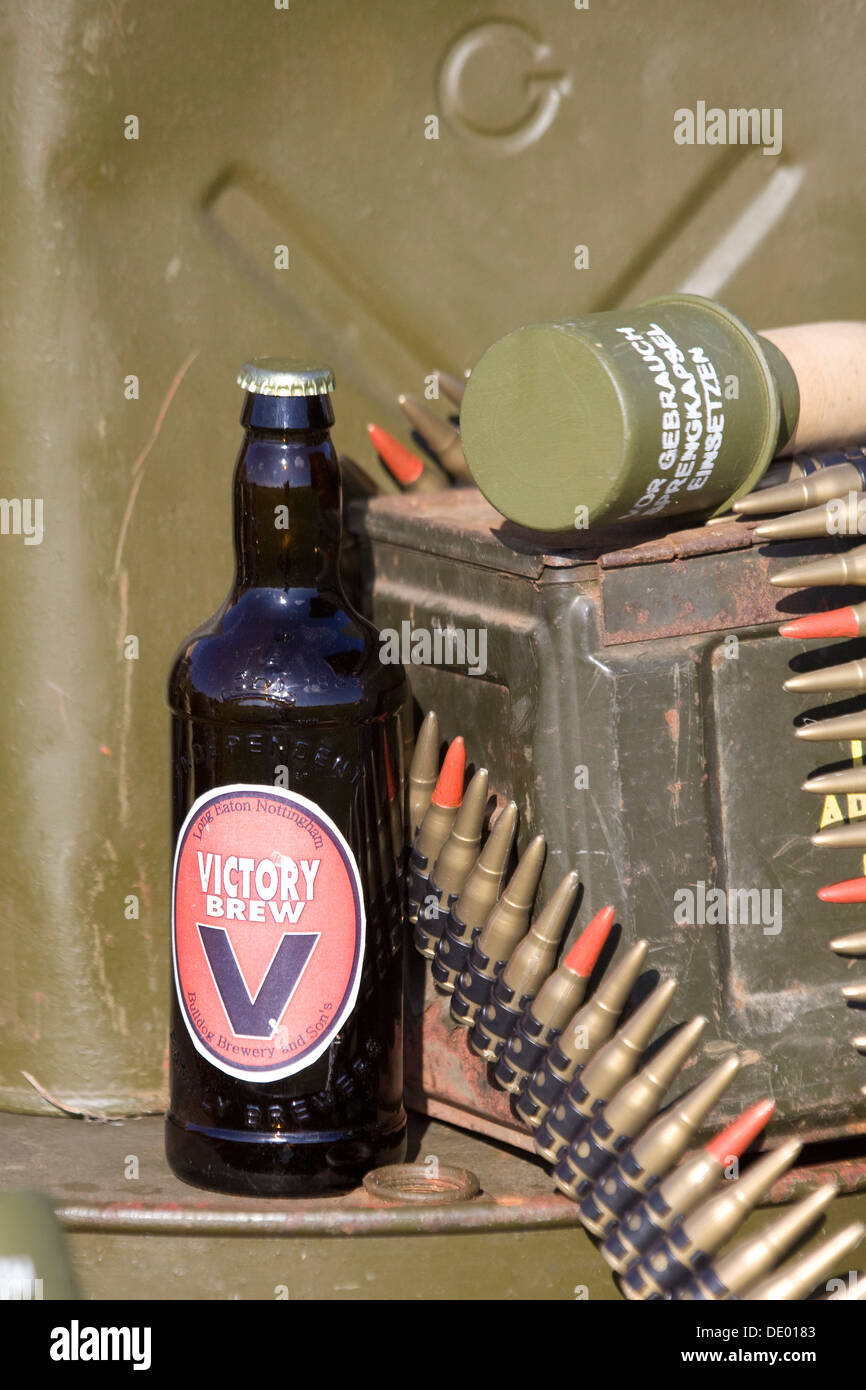 Belt of 0.50 caliber ammunition Fifth round with a red tip is an M20 armour piercing incendiar with a bottle of Victory Brew Stock Photo