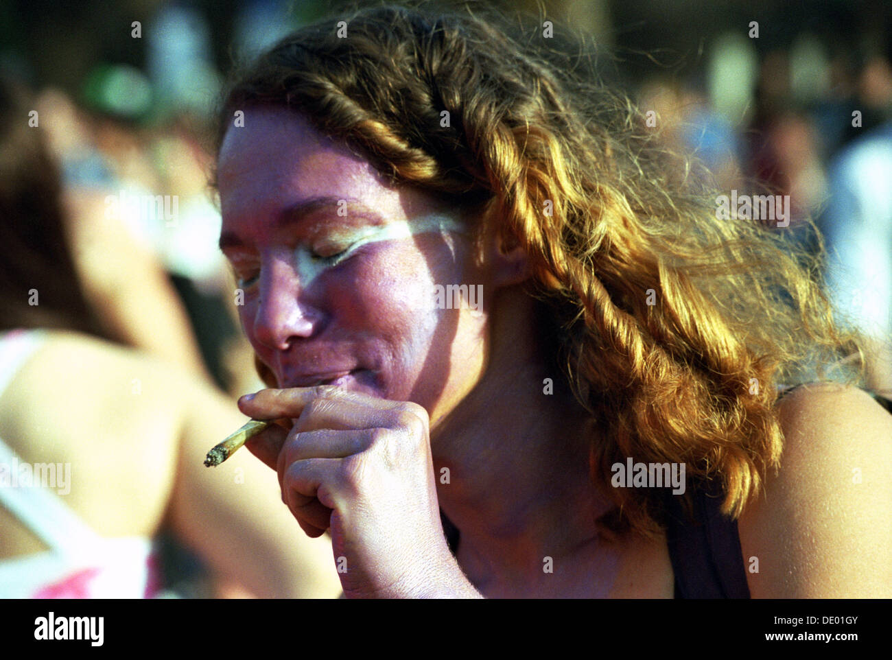 A young woman smoking joint at the annual Cannabis festival Tel Aviv