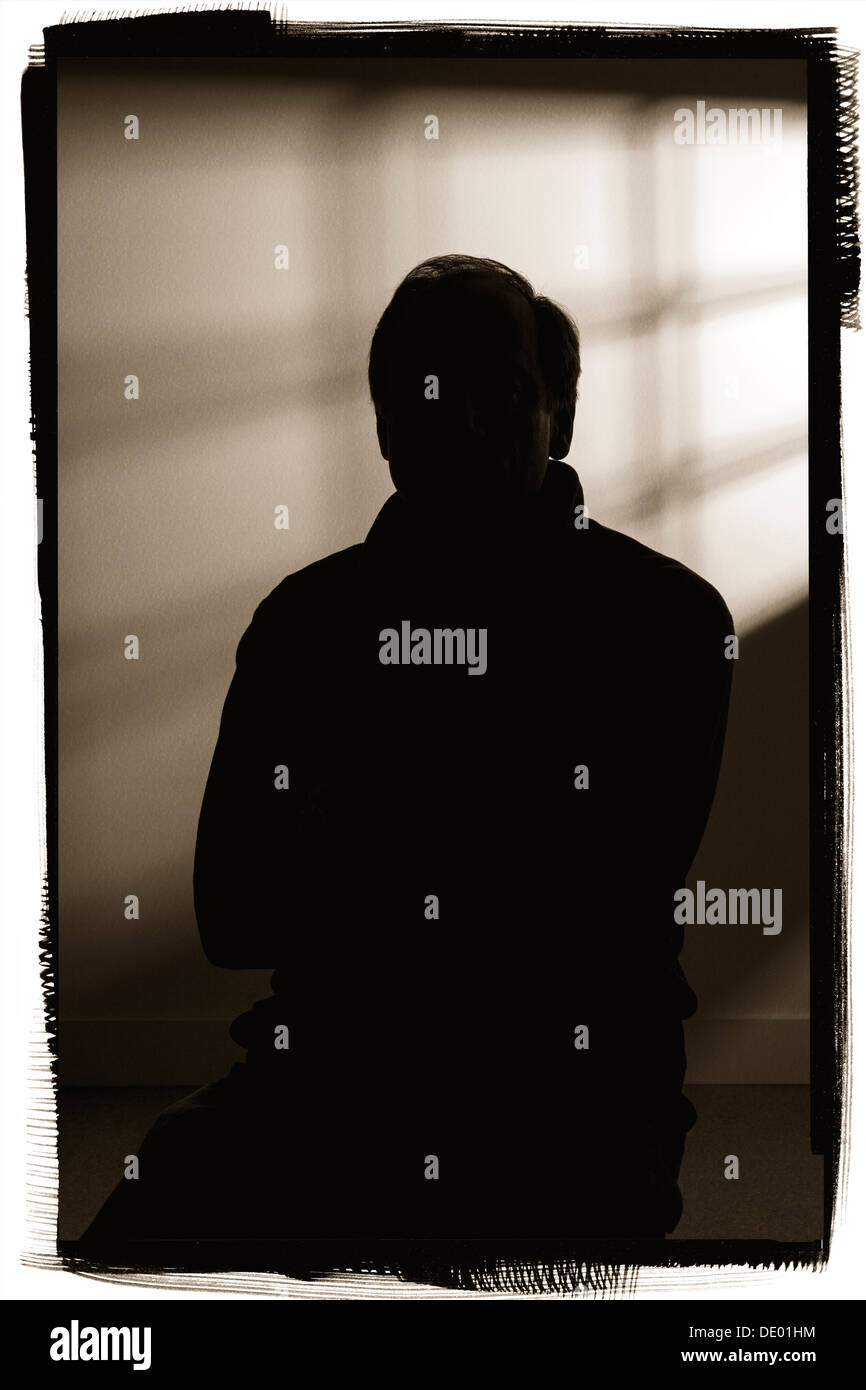 Dramatic silhouette studio portrait of man Stock Photo