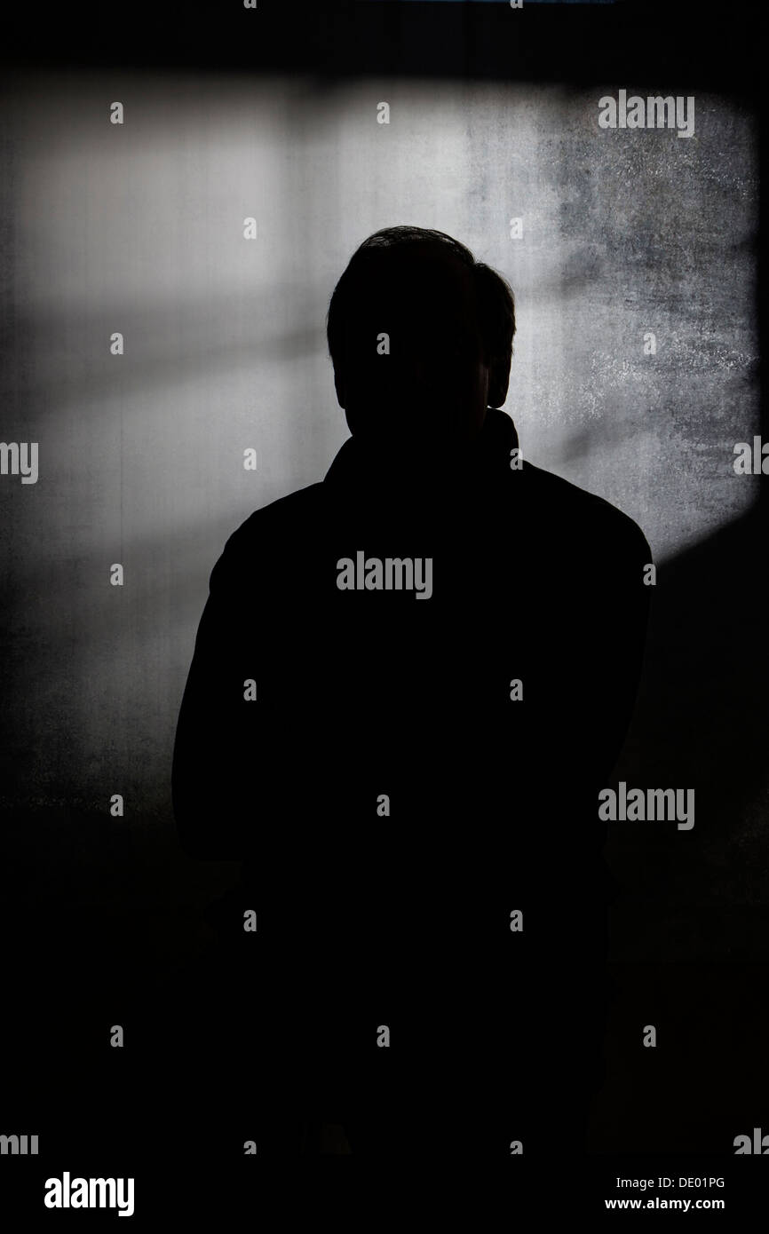 Dramatic silhouette studio portrait of man Stock Photo