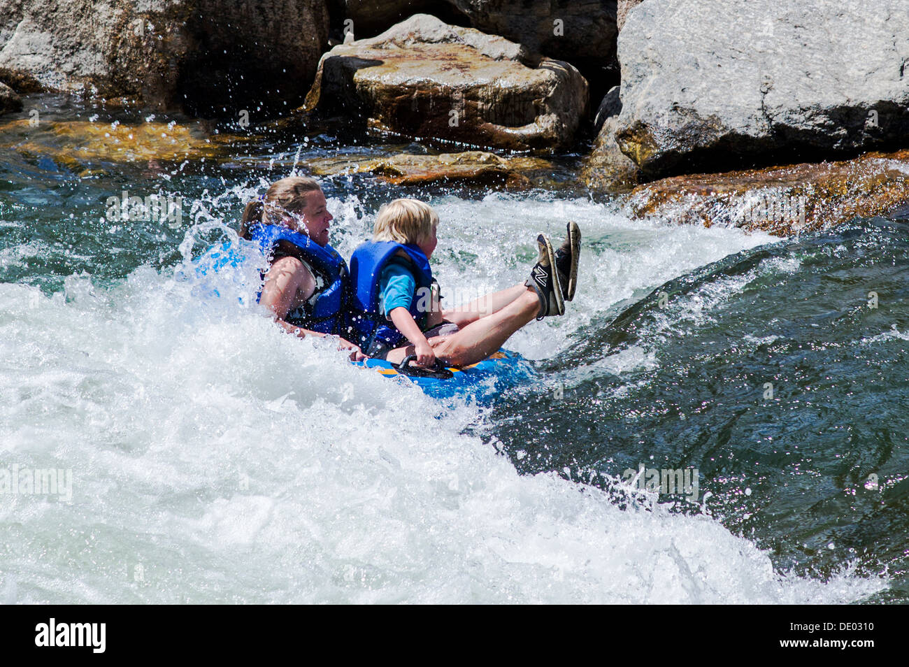 Mother & son tubing the rapids on the Arkansas River, Salida Stock