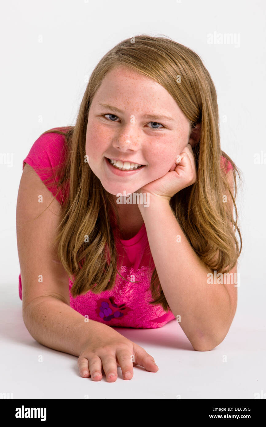 Studio portrait of cute red haired ten year old girl Stock Photo