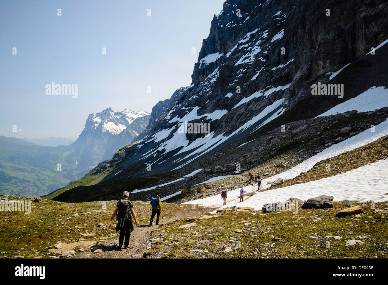 Hikers on the Eiger Trail near Grindelwald Switzerland. The trail runs  directly below the North Face of the Eiger Stock Photo - Alamy