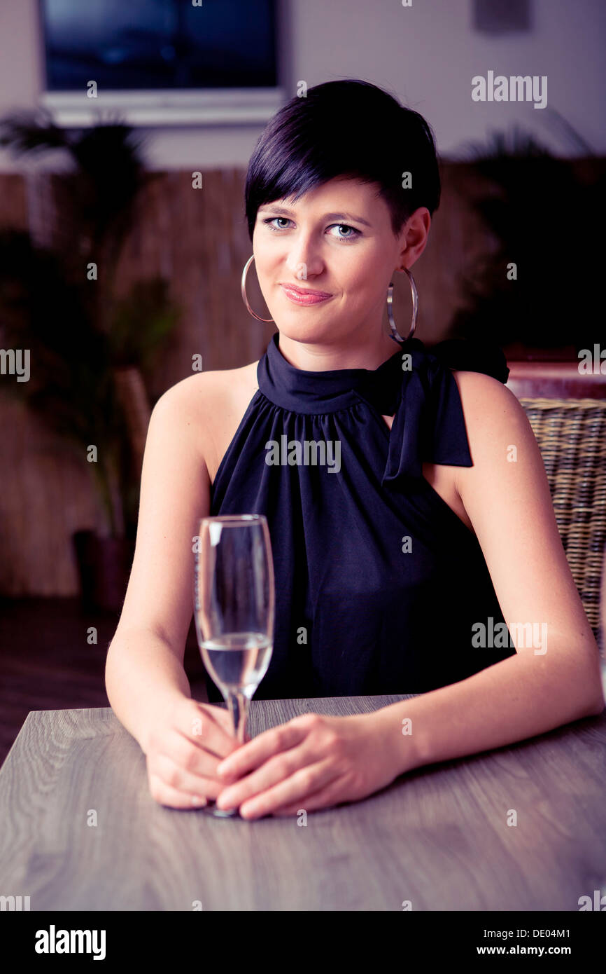 Young woman in a bar Stock Photo