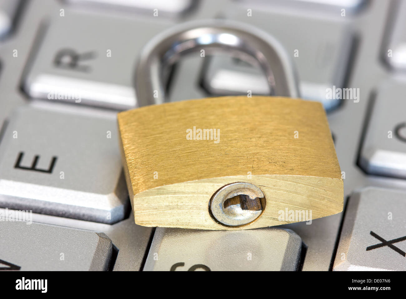 Concept of computer safety, golden lock on the keyboard Stock Photo Alamy
