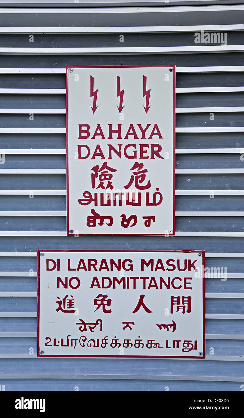 Multi-lingual warning signs, 'danger' and 'no admittance' Stock Photo