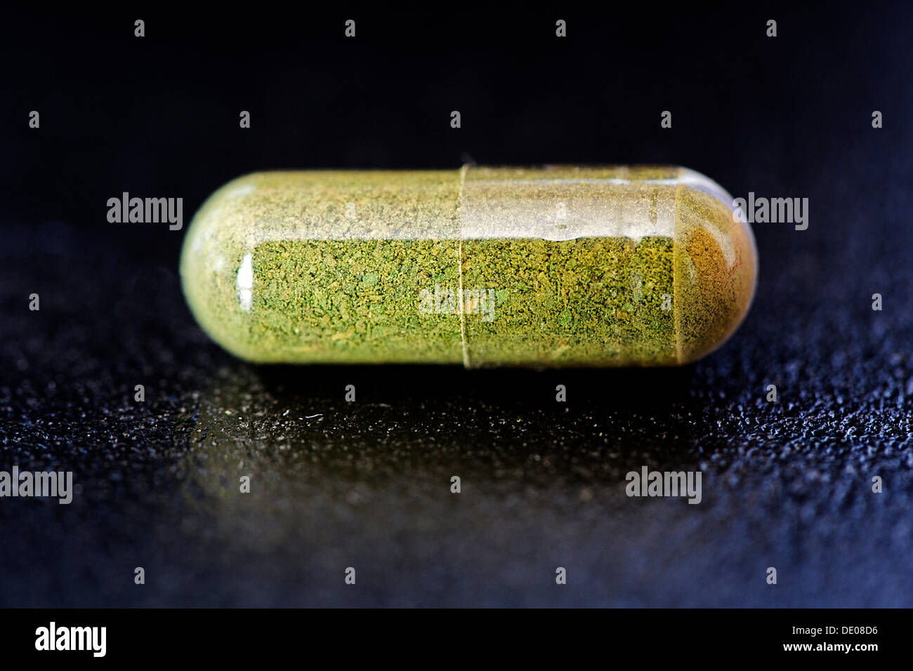 Moringa powder in a capsule Stock Photo
