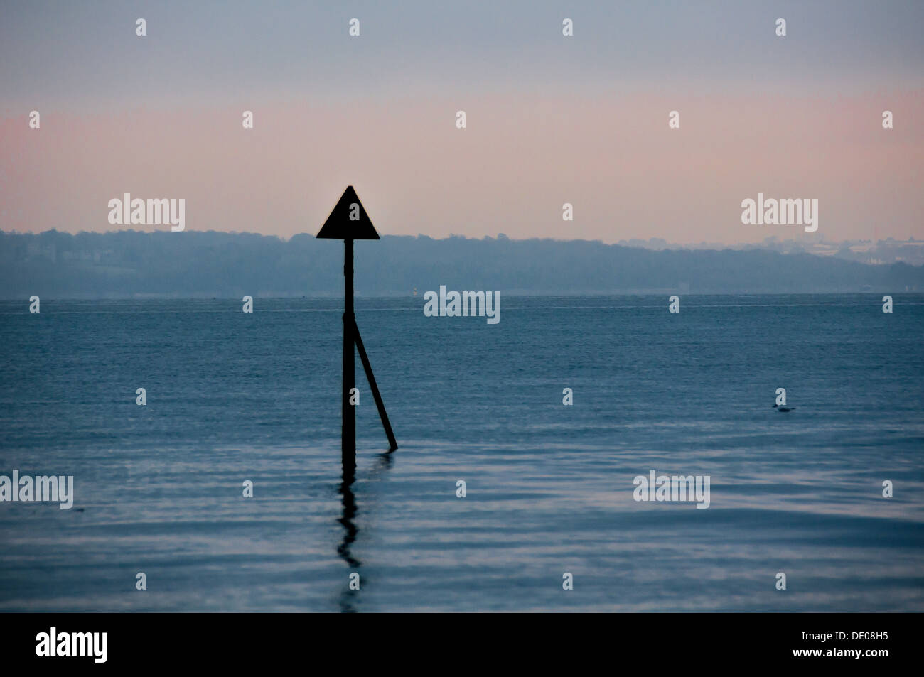 A sea beacon advising sailors of shallow water Stock Photo
