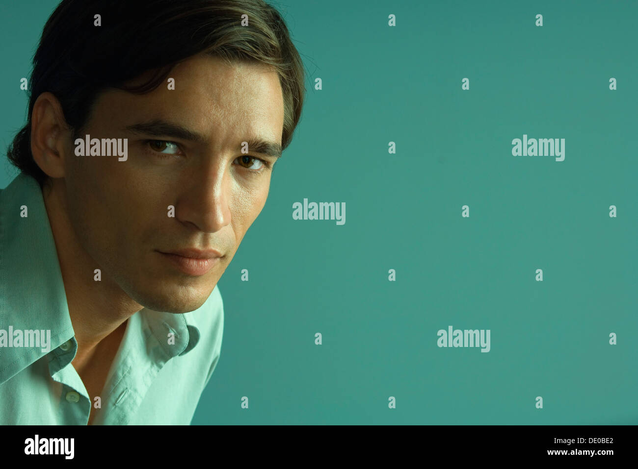 Man confidently looking at camera, portrait Stock Photo