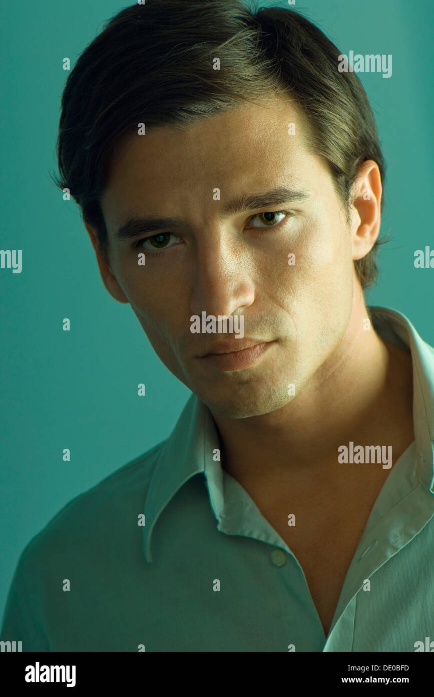 Handsome man looking seductively at camera, portrait Stock Photo