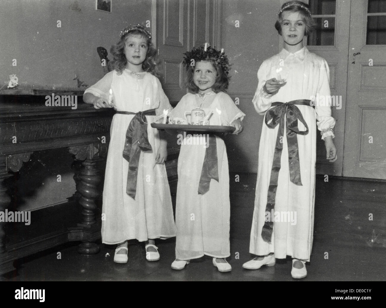 Princesses Birgitta, Desiree and Margaretha of Sweden, St Lucy's Day, 1943. Artist: Karl Sandels Stock Photo