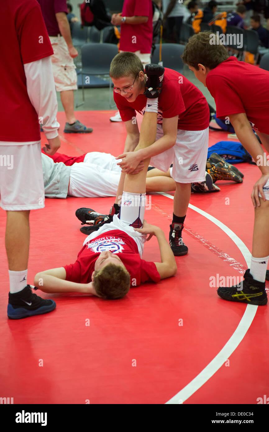 Detroit, Michigan - Wrestlers stretch before competition at the AAU Junior Olympic Games. Stock Photo