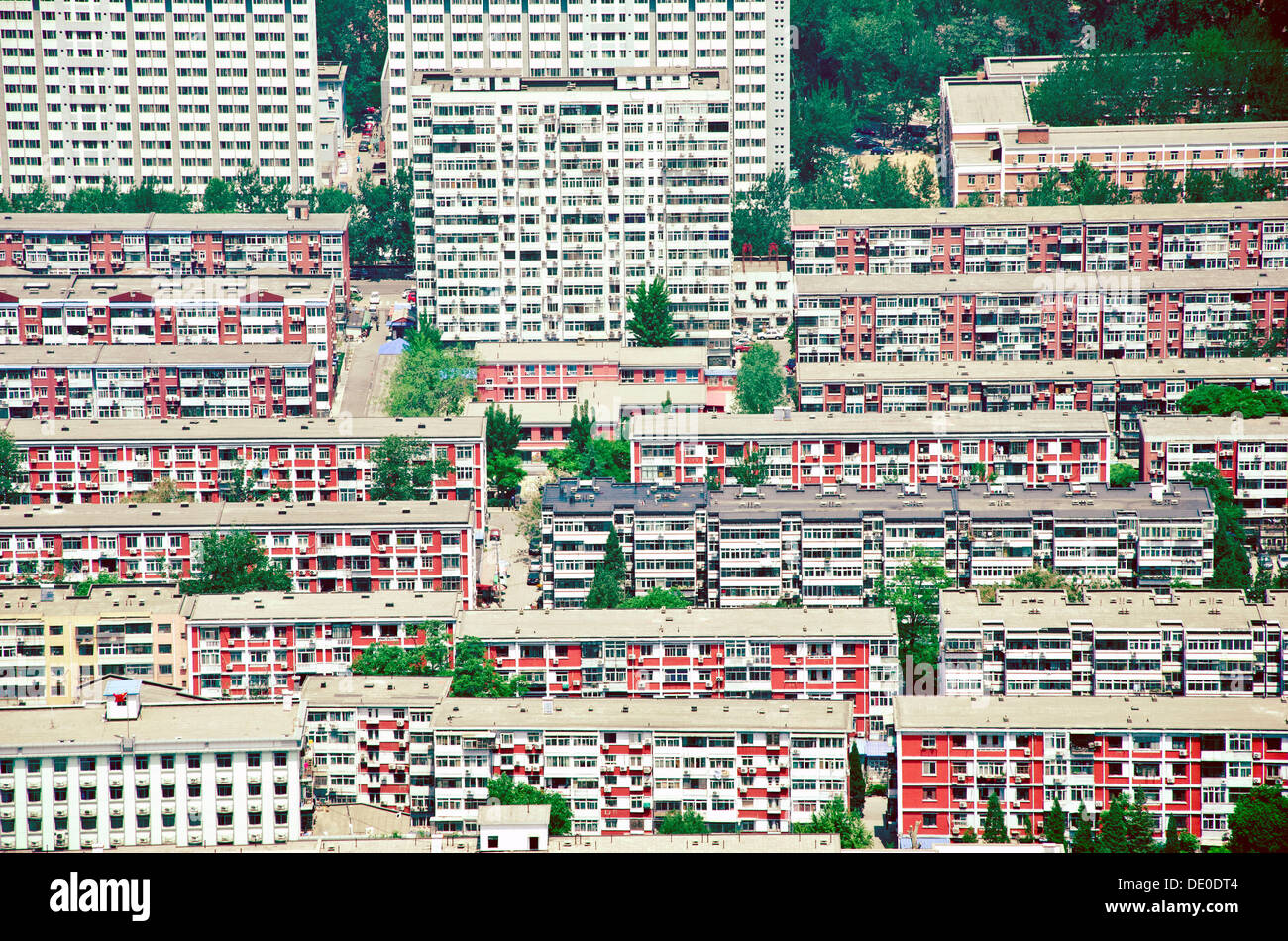 a living quarter in Beijing with many similar apartment block and numerous windowns Stock Photo