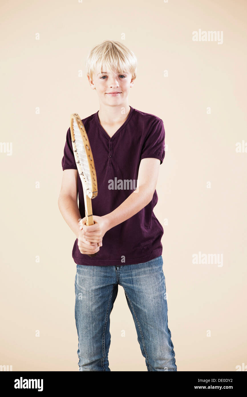 Boy holding a tennis racket Stock Photo