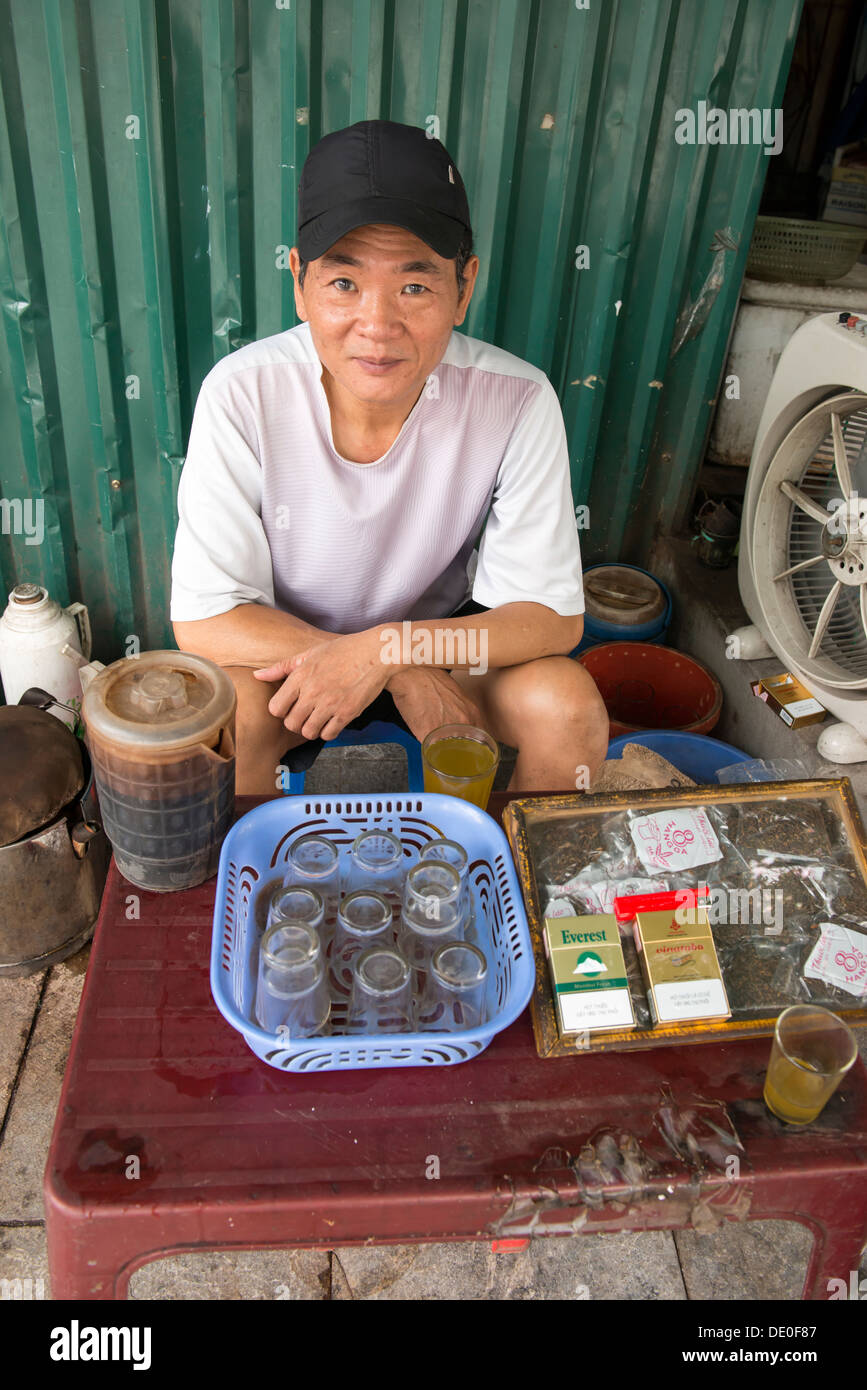 Smoking cigarette and Vietnamese tea street stall owner in Hanoi ...