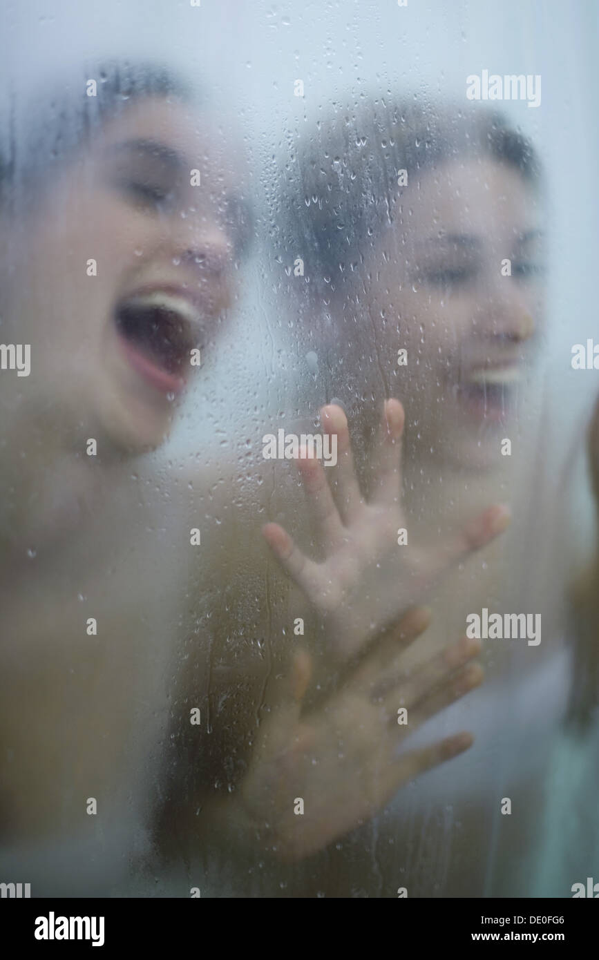 Two young women having fun in bathroom Stock Photo