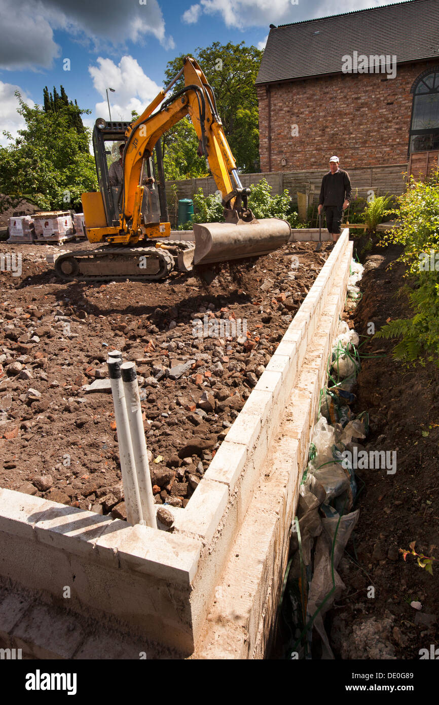 self building house, preparing site, JCB digger preparing base for floor slab Stock Photo