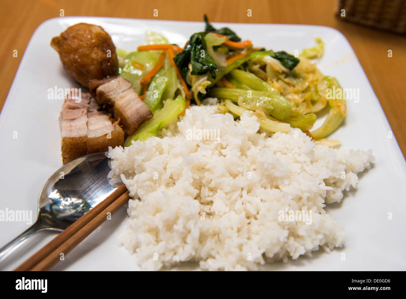 Vietnamese dish rice and vegetable and deep fried pork in the local