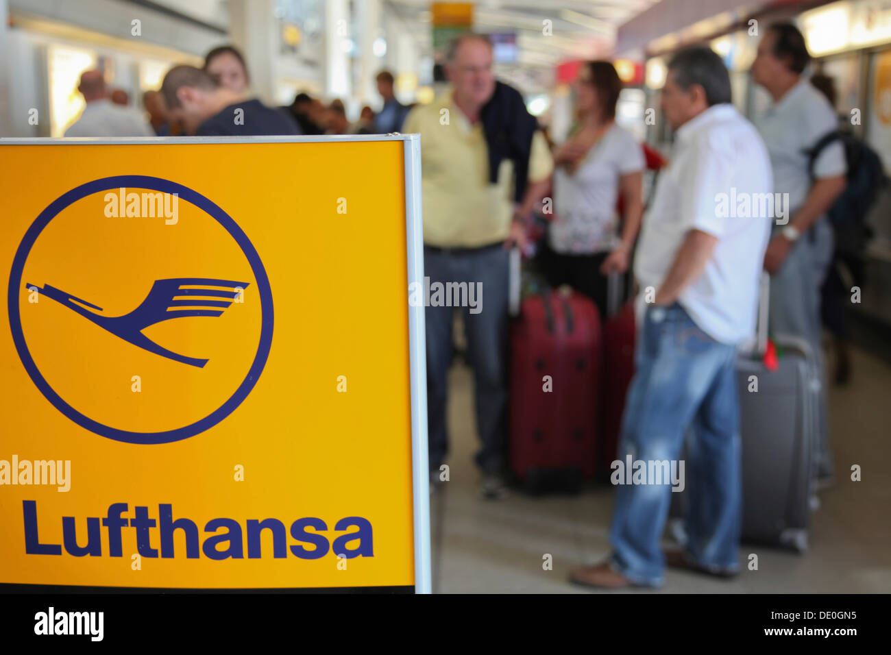 Passengers waiting at the airport, delays and canceled flights due to the strike of the Lufthansa flight attendants Stock Photo
