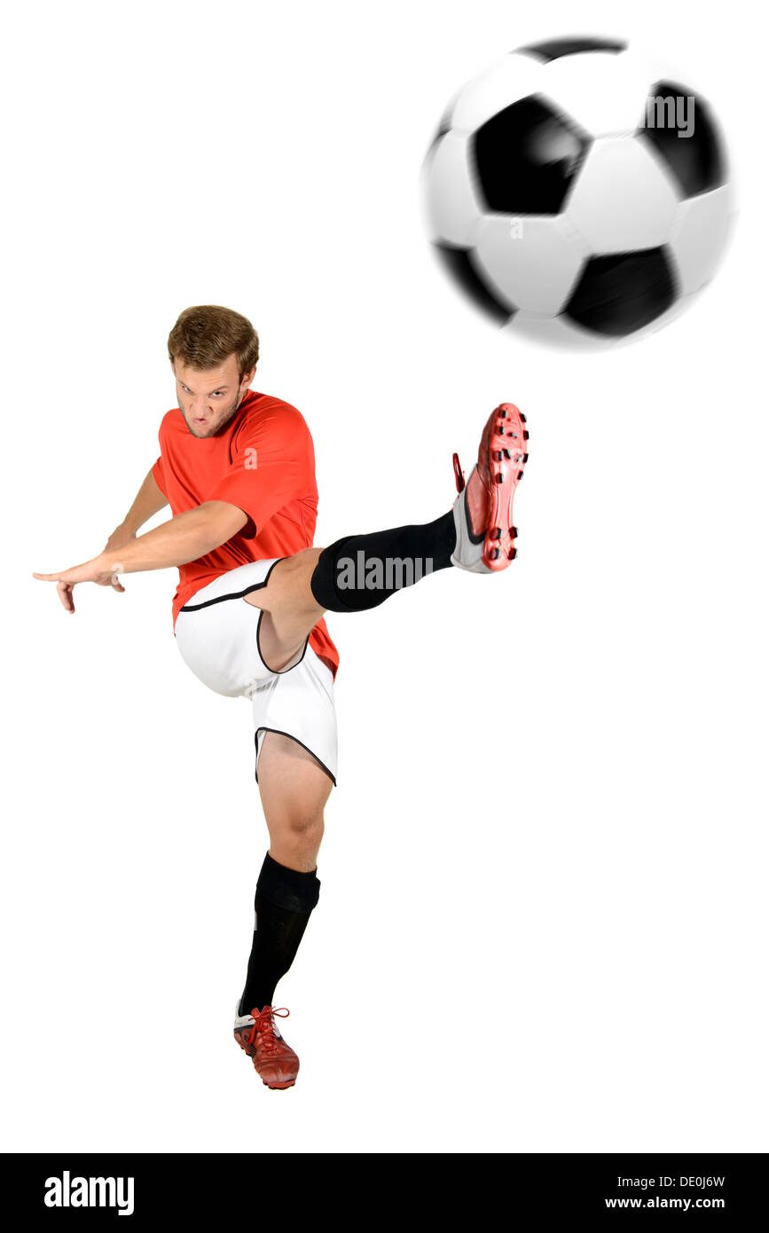 Football player kicking a ball isolated in white Stock Photo Alamy