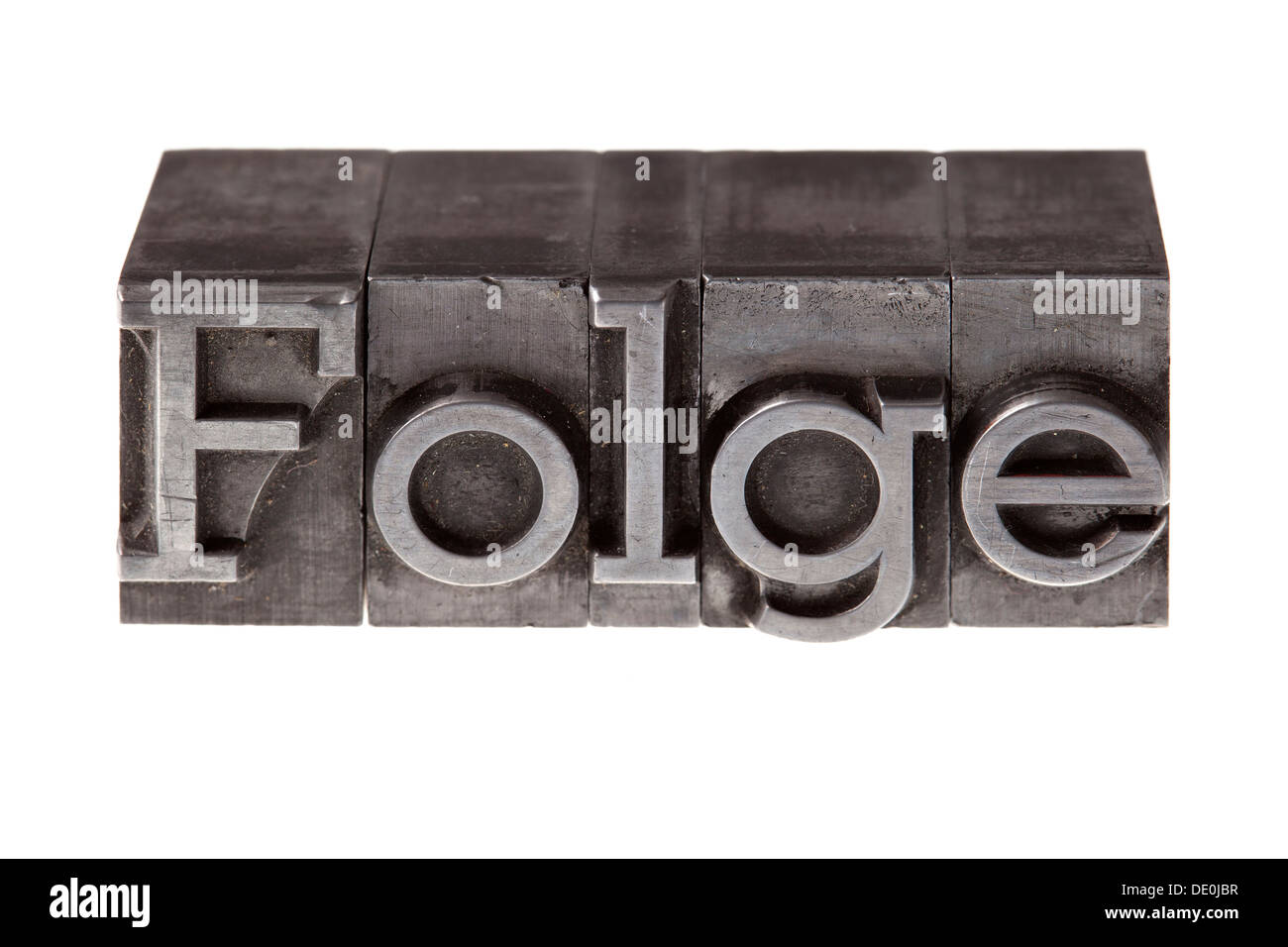 Old lead letters forming the word 'Folge', German for 'consequence' Stock Photo