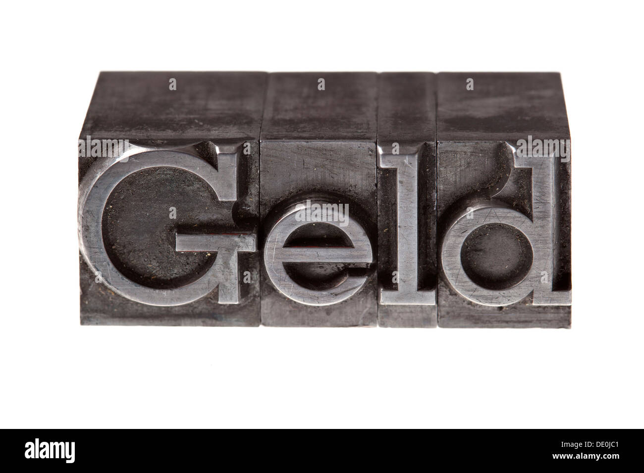 Old lead letters forming the word 'Geld', German for 'money' Stock Photo