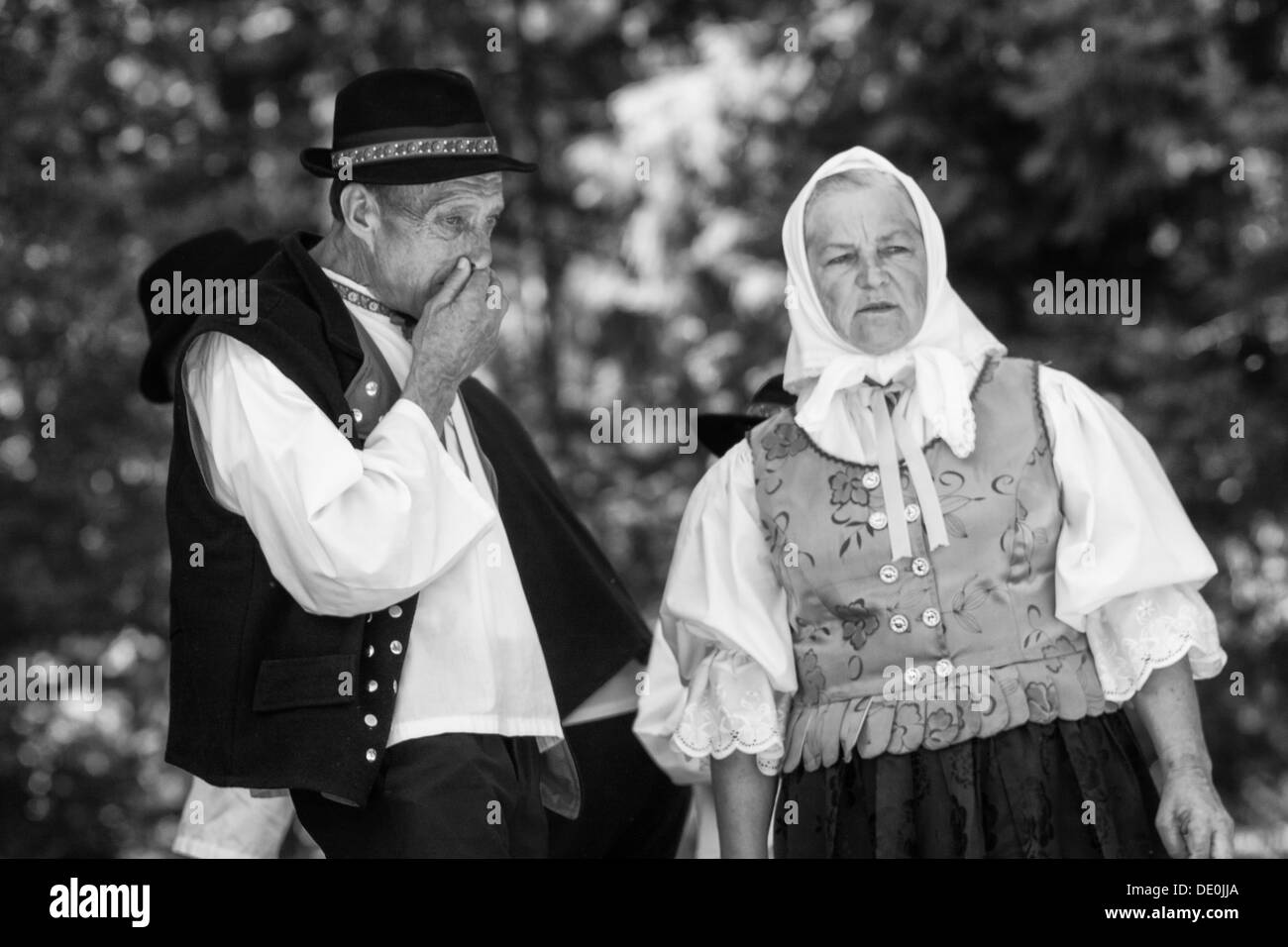 Old man and woman in costume Stock Photo