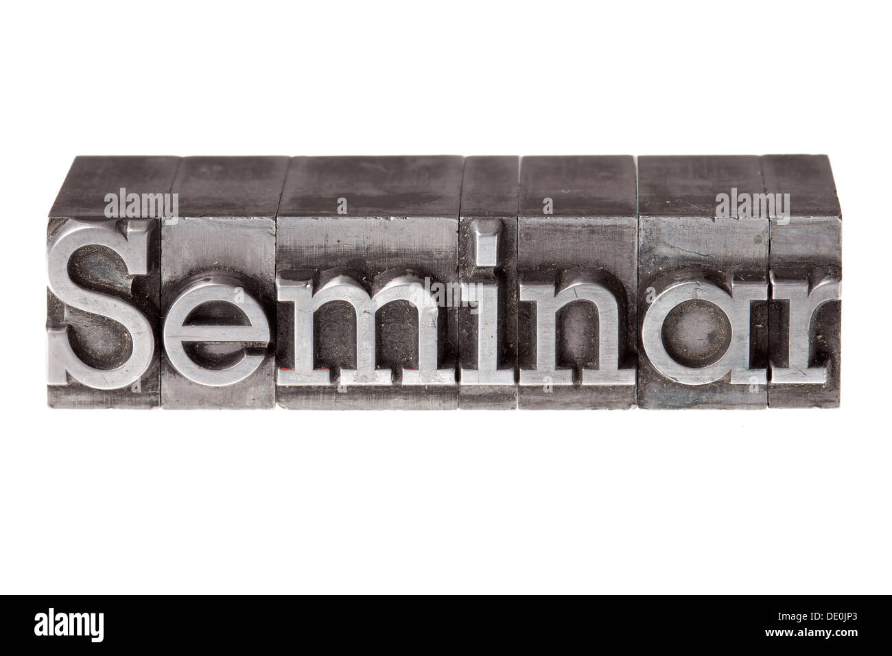 Old lead letters forming the word 'Seminar' Stock Photo