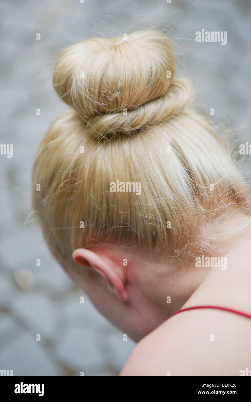 Woman's hair arranged in a chignon Stock Photo