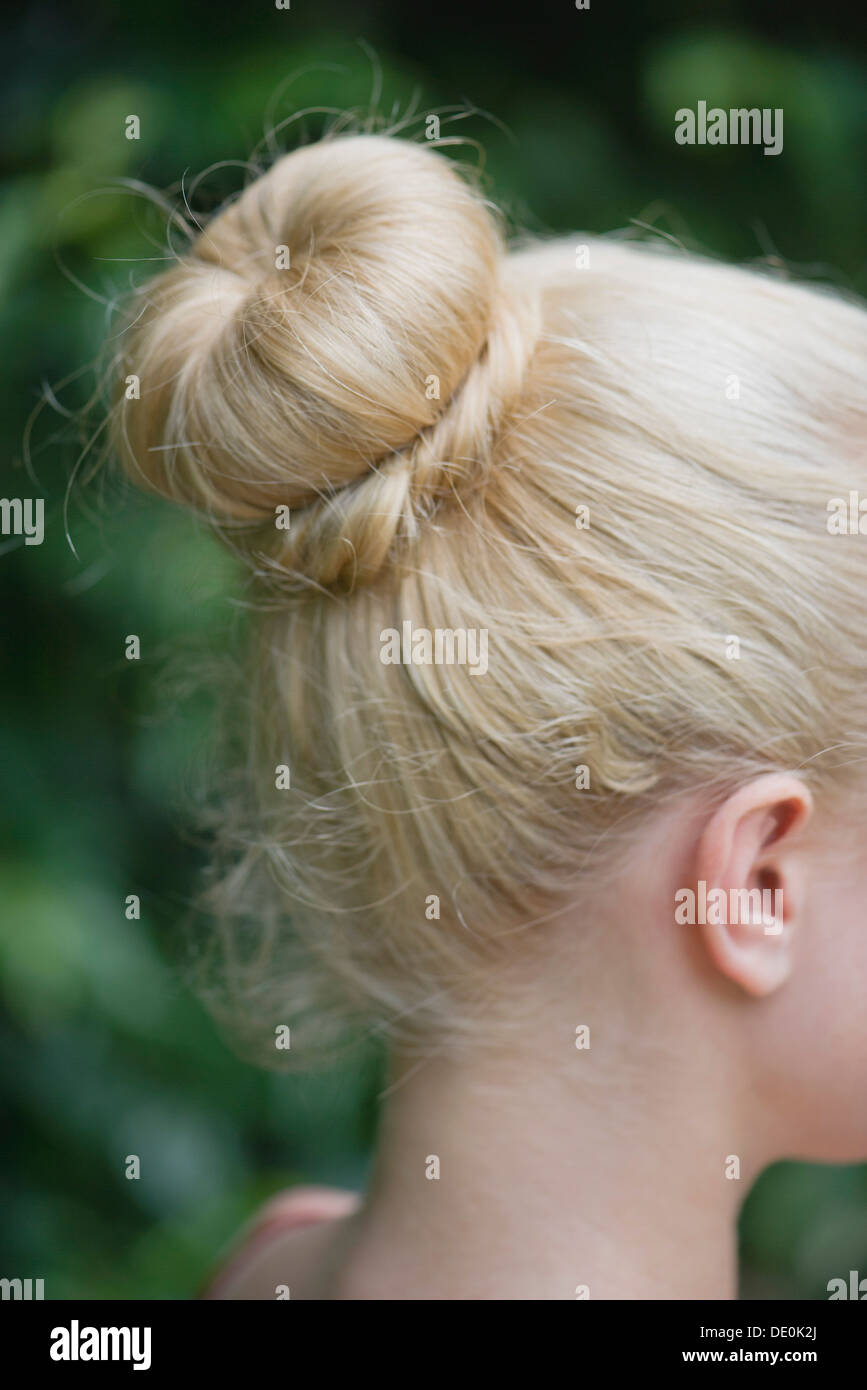 Woman's hair arranged in a chignon Stock Photo