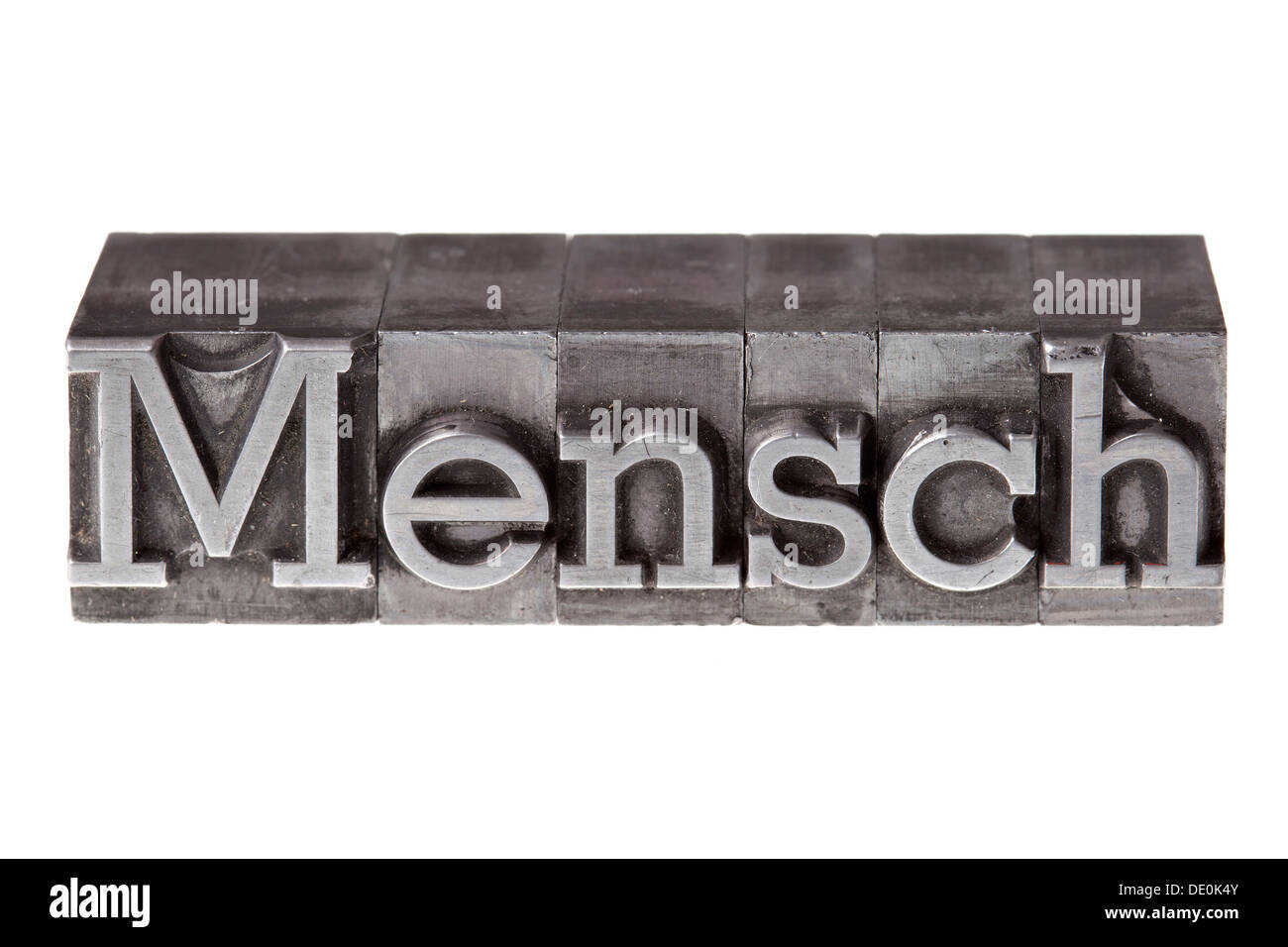 Old lead letters forming the word 'Mensch', German for person or human being Stock Photo