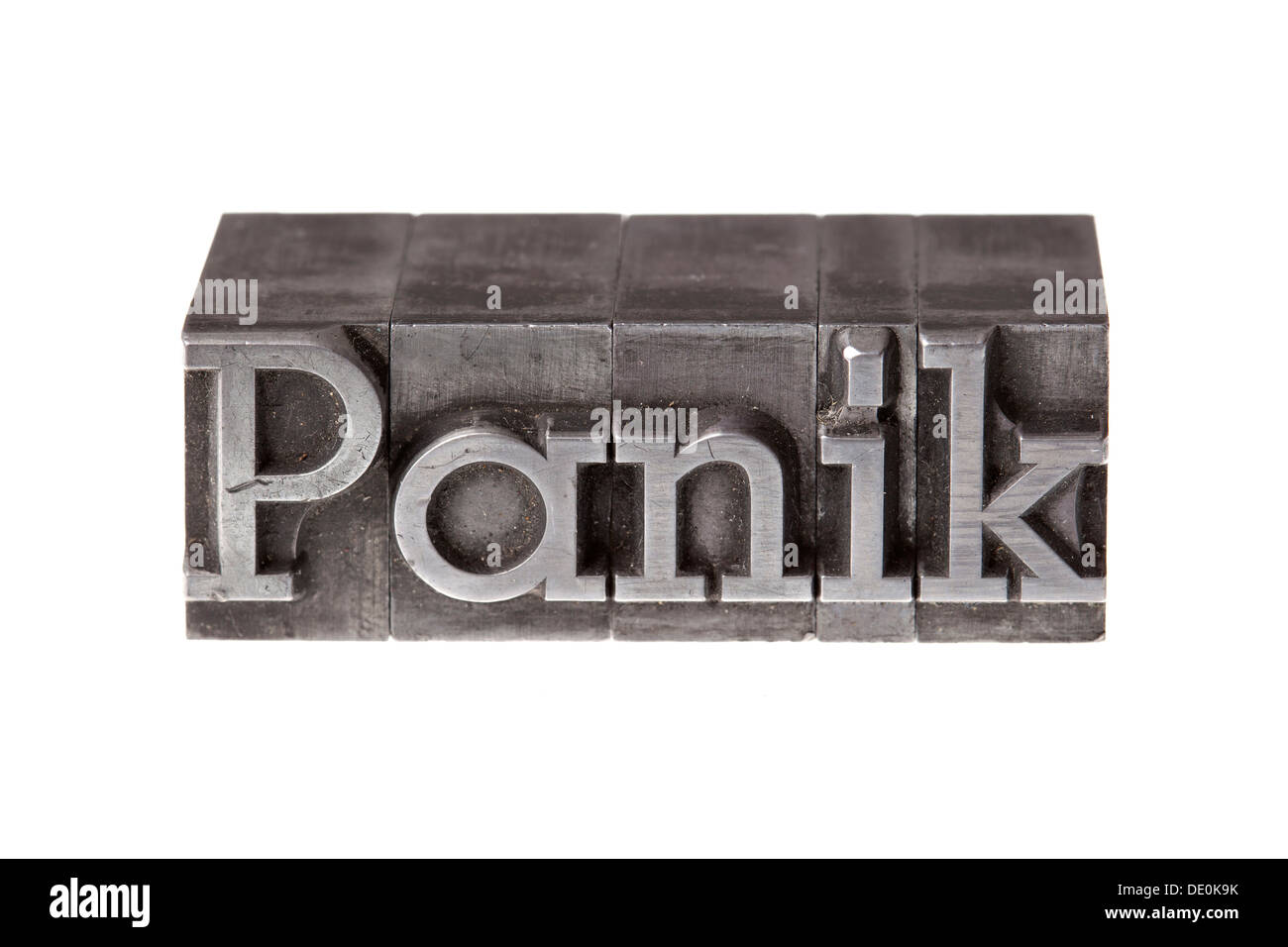 Old lead letters forming the word 'Panik', German for panic Stock Photo