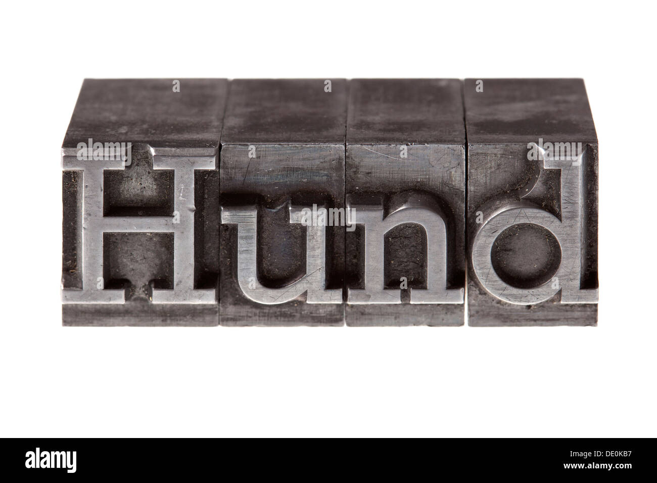 Old lead letters forming the word 'Hund', German for dog Stock Photo