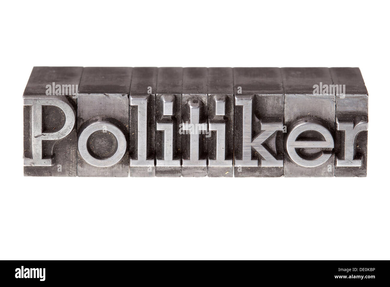 Old lead letters forming the word 'Politiker', German for politician Stock Photo
