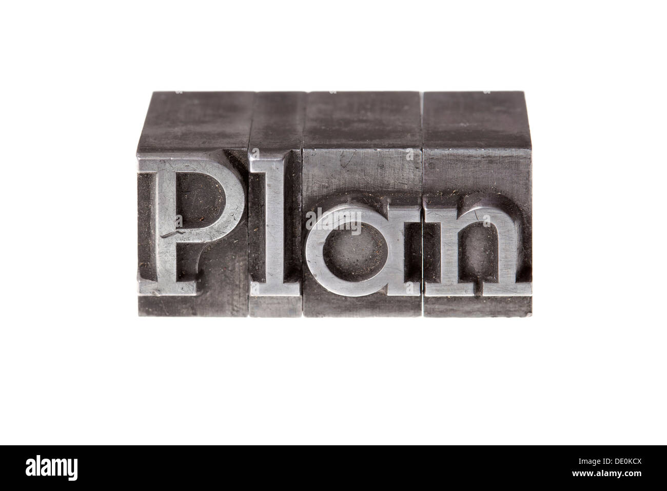 Old lead letters forming the word "Plan" Stock Photo