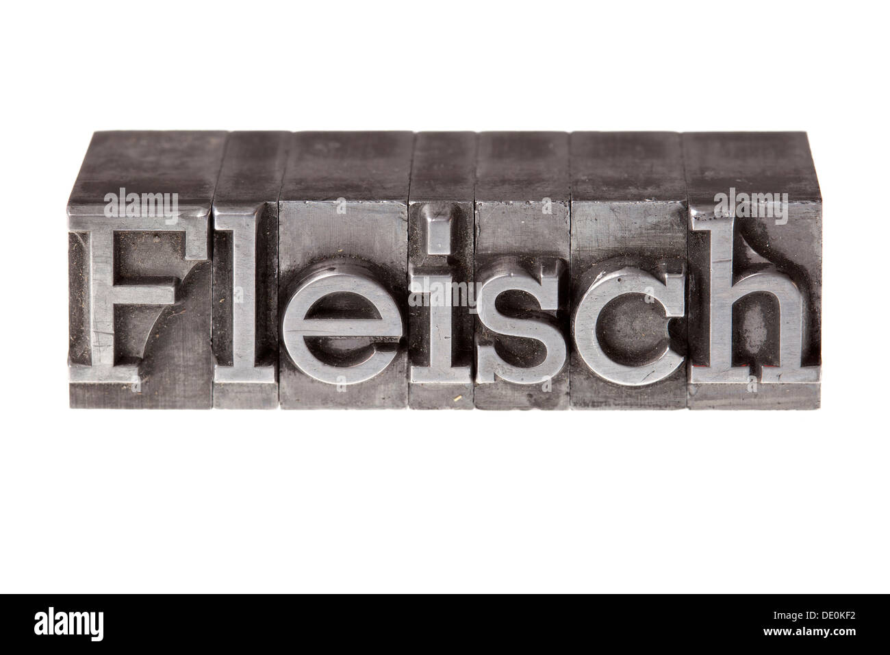 Old lead letters forming the word 'Fleisch', German for meat Stock Photo
