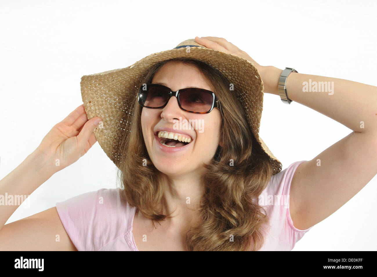 Young woman with sunglasses and a straw hat Stock Photo - Alamy