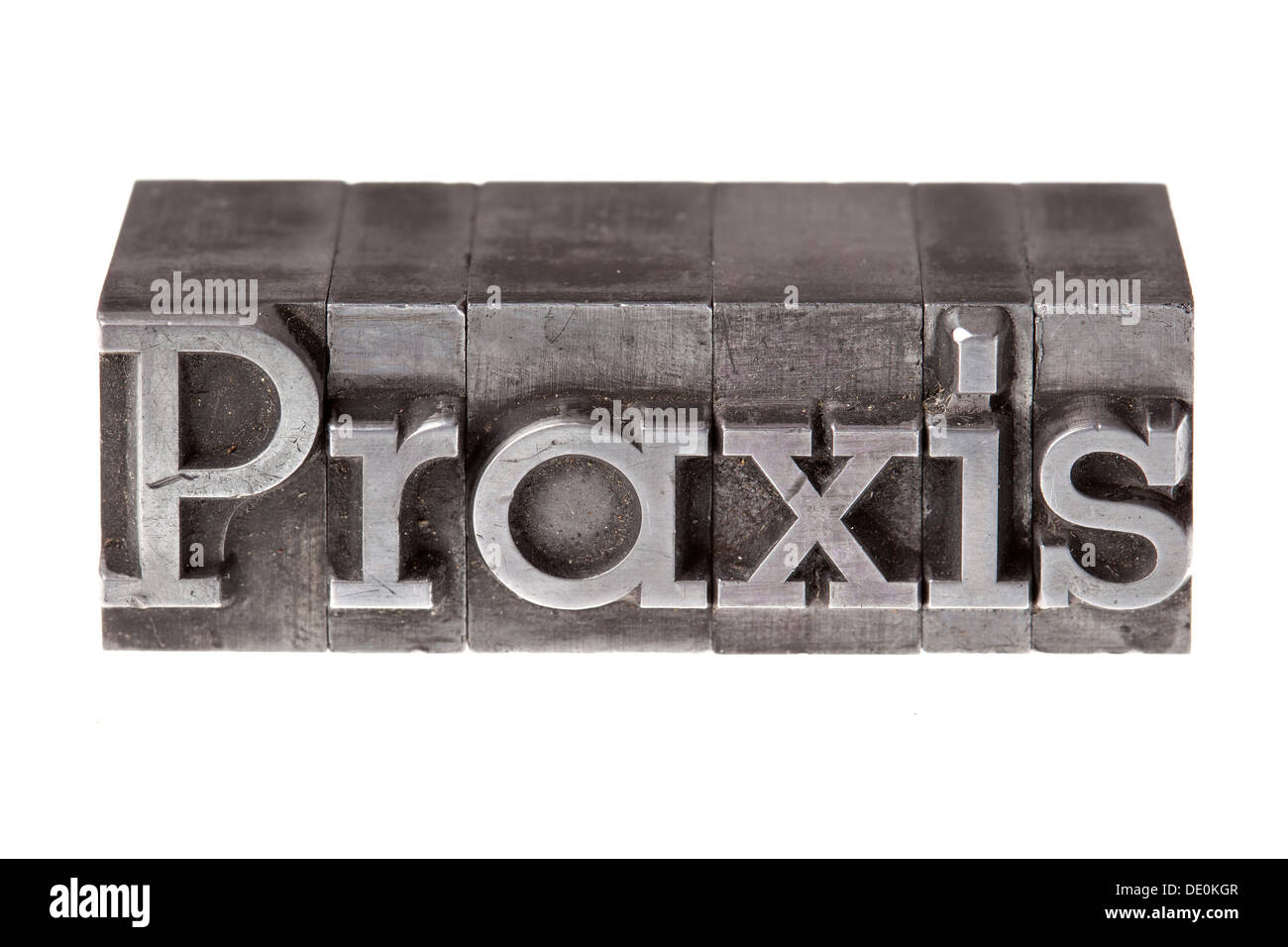 Old lead letters forming the word 'Praxis', German for practice Stock Photo