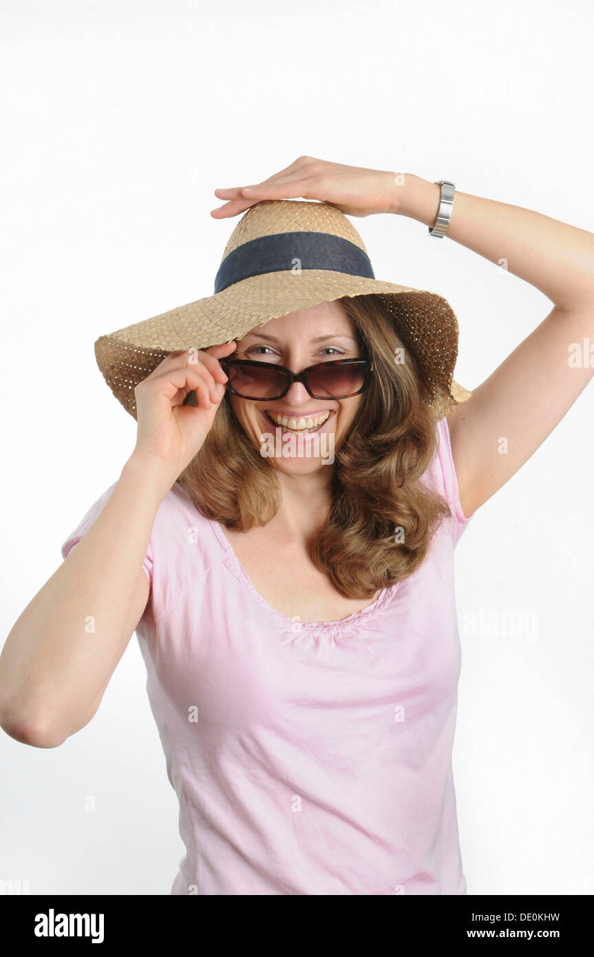 Young woman with sunglasses and a straw hat Stock Photo - Alamy