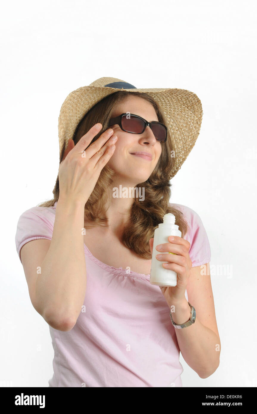 Young woman with sunglasses and a straw hat Stock Photo - Alamy