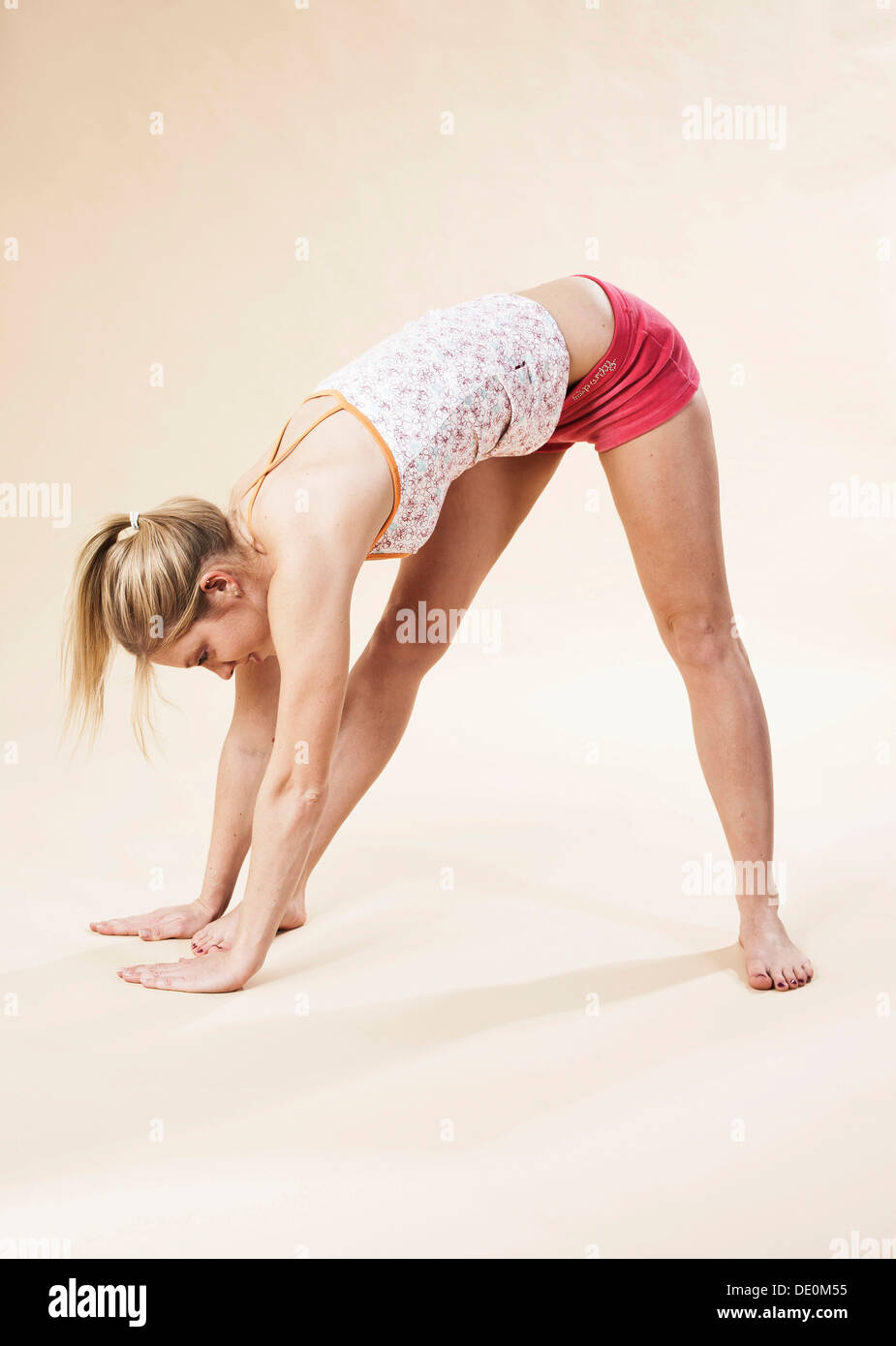 Young woman stretching Stock Photo