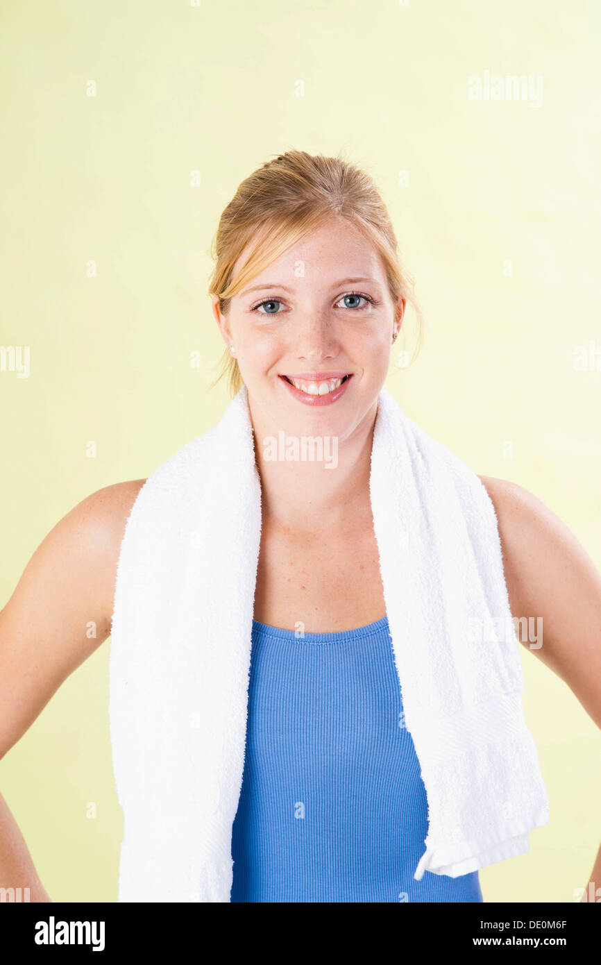 Smiling young woman after doing sport Stock Photo