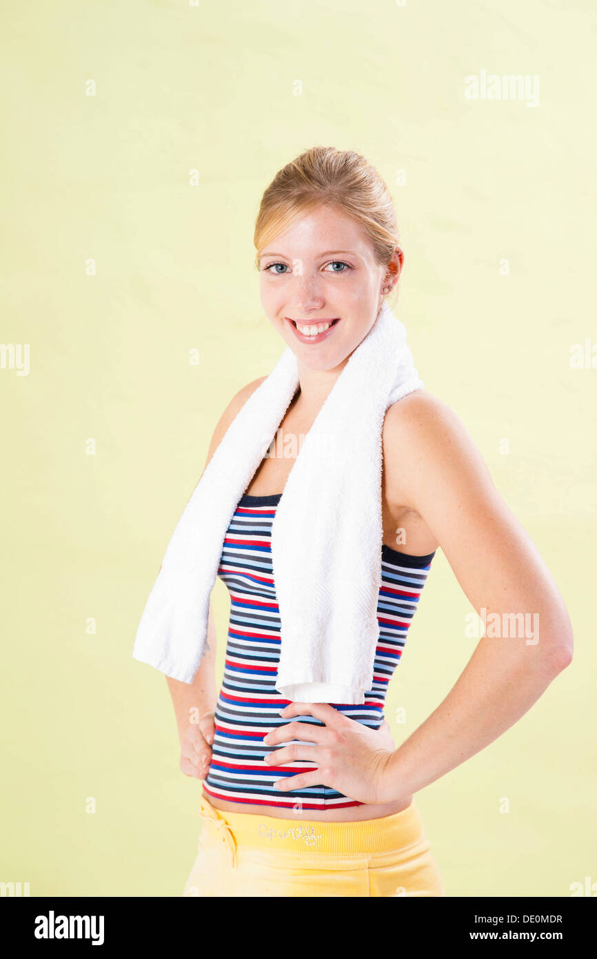 Smiling young woman after doing sport Stock Photo