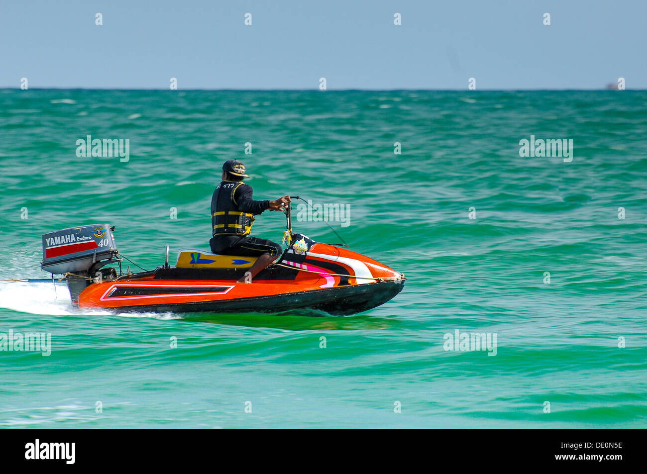 Man enjoying his jet ski on a Thailand Beach Stock Photo Alamy