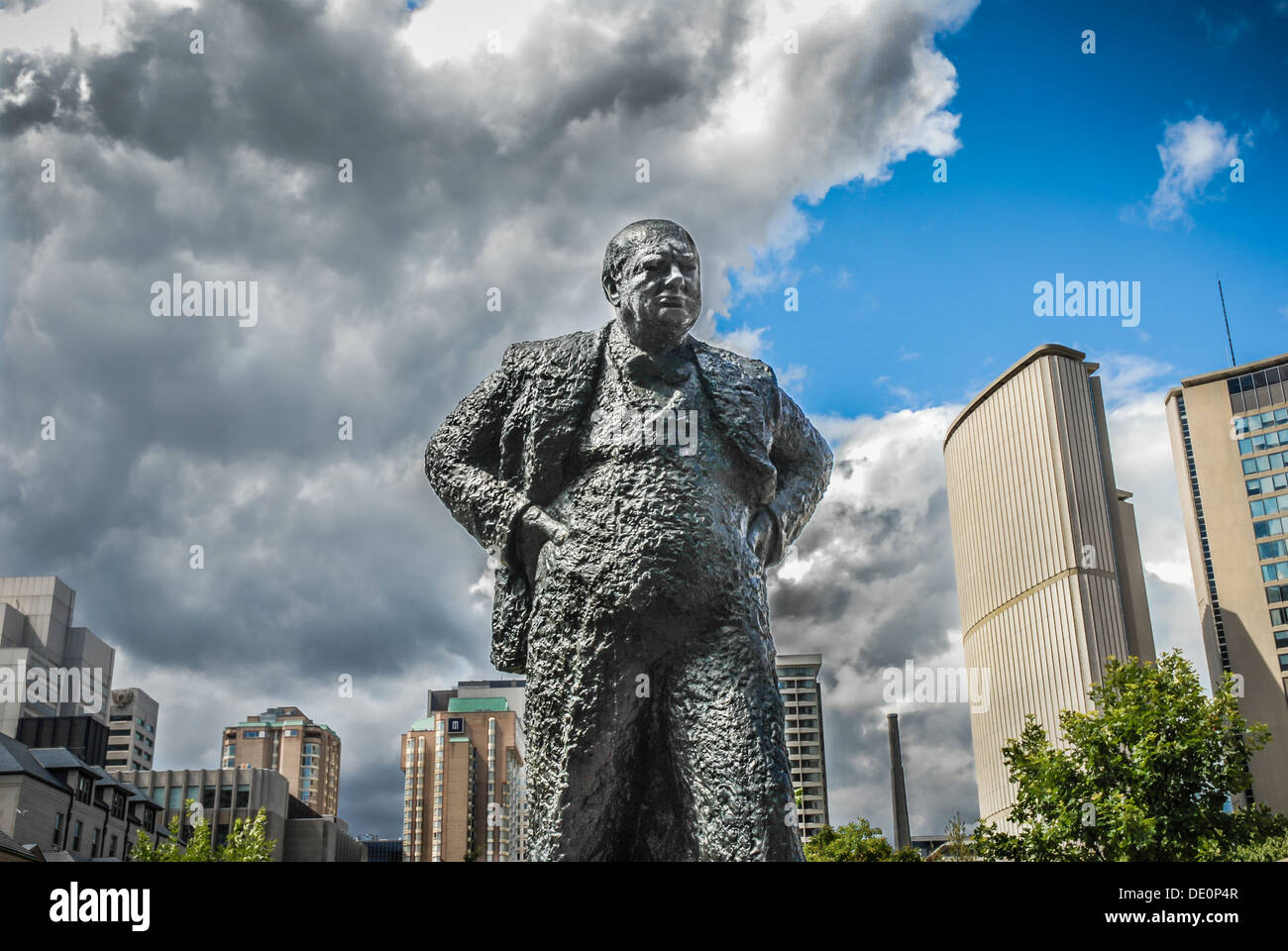 Sir Winston Churchill Memorial in Toronto, Canada with dramatic sky behind symbolic of coming out of dark times into blue skies. Stock Photo