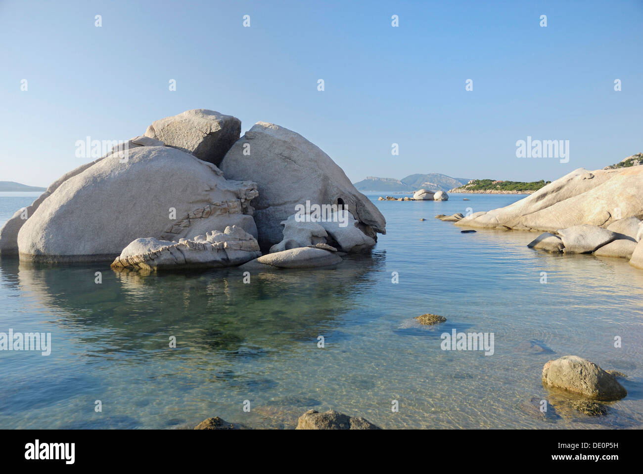 Rounded granite boulder in clear coastal waters, near Olbia, Sardinia, Italy, Europe Stock Photo