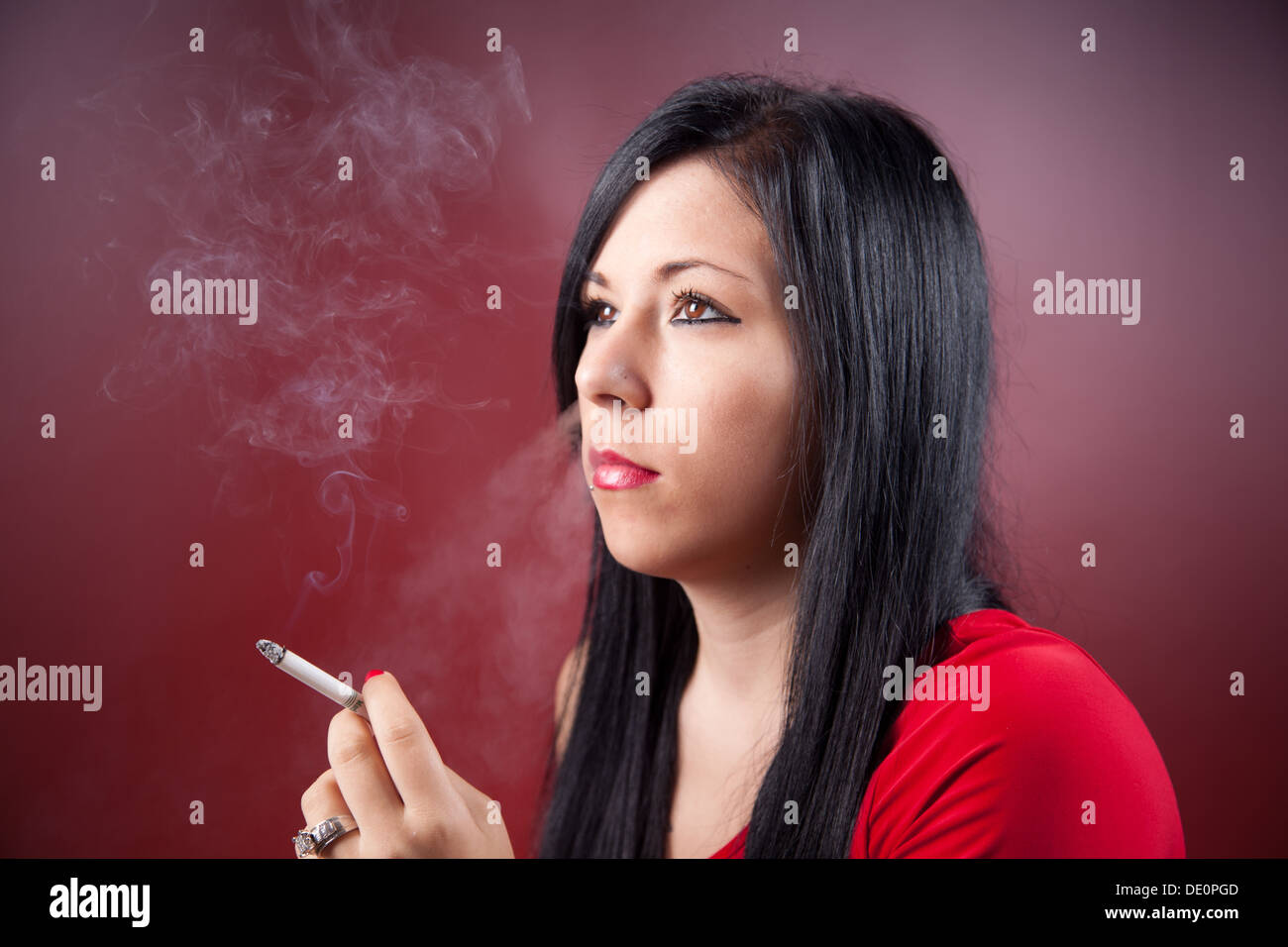 Young woman smoking a cigarette Stock Photo