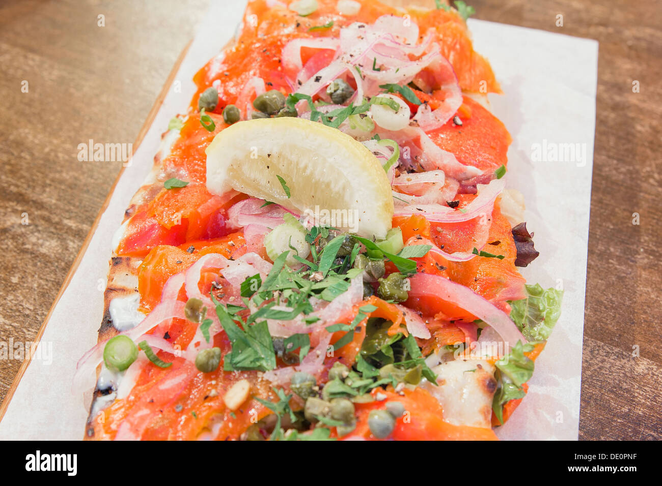 Smoked Salmon on Focaccia Bread with Cream Cheese Garnished with Onions