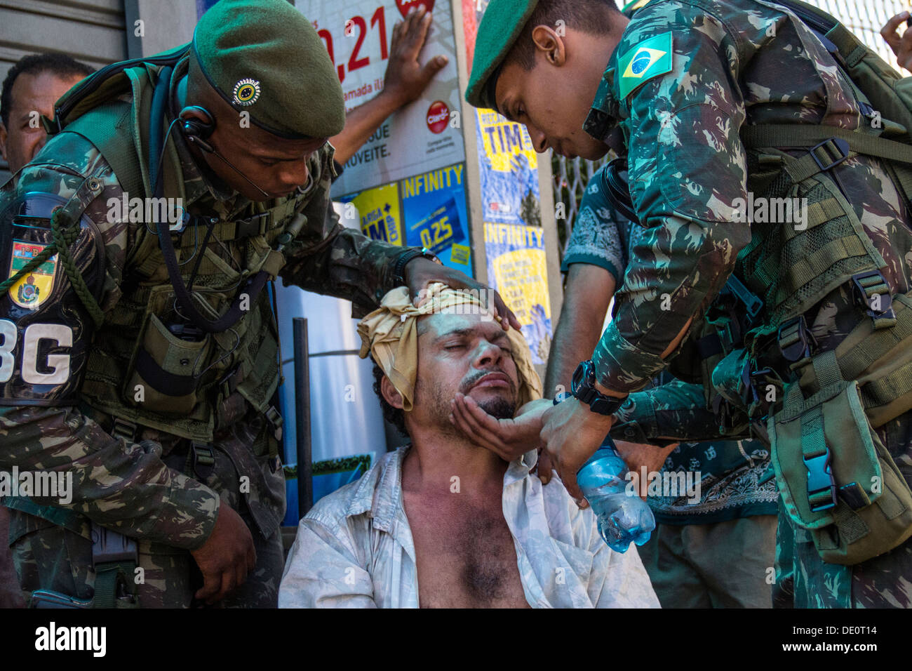 Man gets ill after inhaling tear gas used by military police during protests in Rio de Janeiro Stock Photo